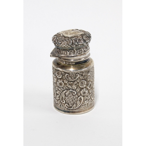 17 - George V silver scent bottle holder, Birmingham 1911, containing a  glass bottle and stopper,  7cm