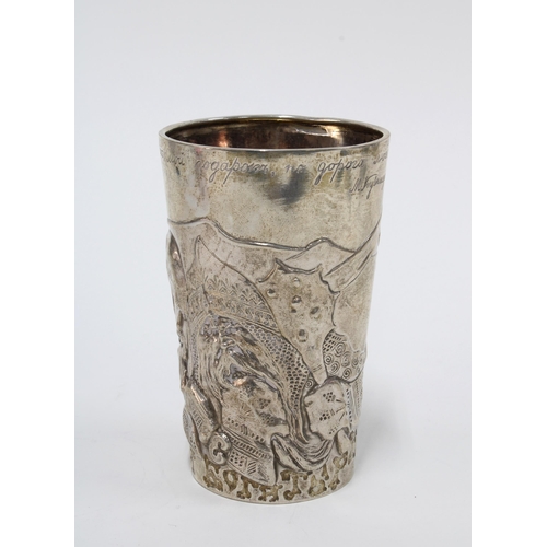 20 - Russian silver beaker with repoussé decoration of warrior heads, inscribed inscription and dated 191... 