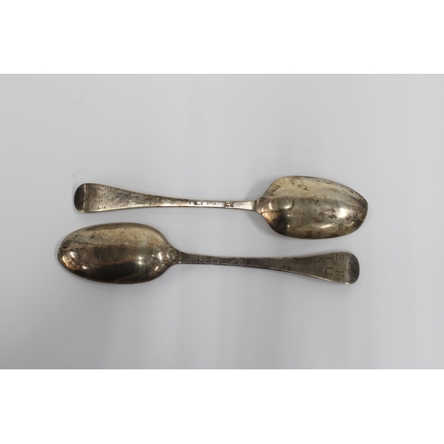 24 - A pair of 18th century silver spoons, hanoverian pattern with initialled handles and rat tail bowls,... 