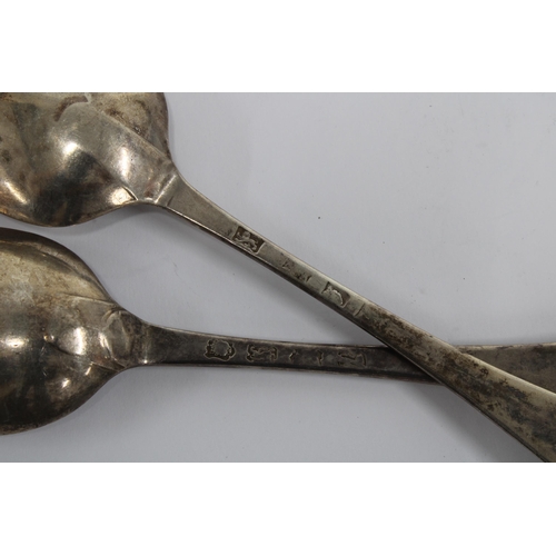 24 - A pair of 18th century silver spoons, hanoverian pattern with initialled handles and rat tail bowls,... 