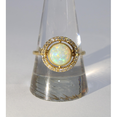 33 - Opal and diamond dress ring set in 18ct gold, size S