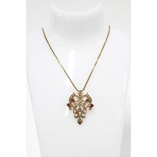 43 - 9ct gold ruby and seed pearl pendant on a later 9ct gold chain