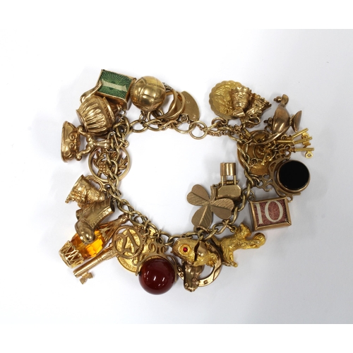 57 - 9ct gold charm bracelet with heart shaped padlock, London 1967, hung with a 21 charms, 19 of which a... 