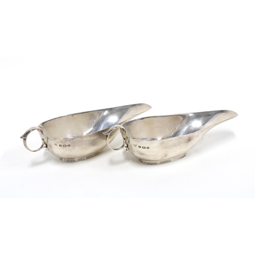 61 - A pair of George V silver sauceboats, Birmingham 1935 16cm long (2)