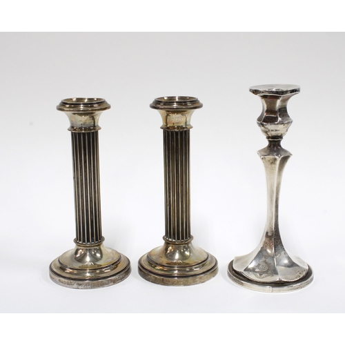 69 - A pair of Continental silver candlesticks and a George V silver candlestick, Birmingham 1916, talles... 