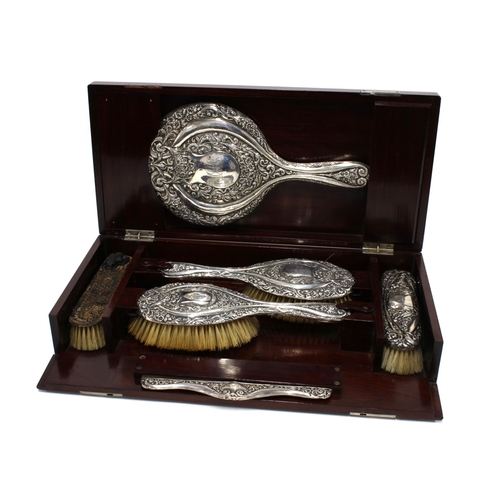 75 - An Edwardian silver backed dressing table brush set, Chester 1908 (backing from one clothes brush la... 