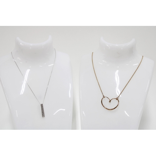 9 - 9ct white gold pendant necklace together with a 9ct gold chain necklace with heart pendant (2)