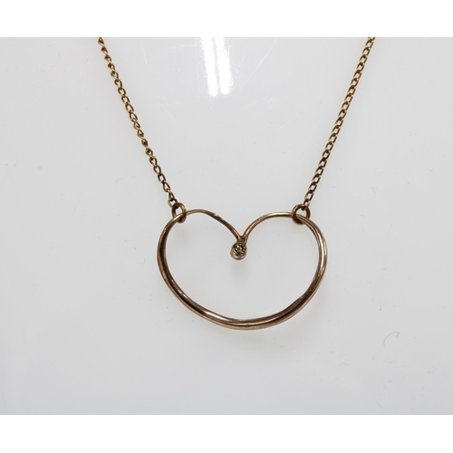 9 - 9ct white gold pendant necklace together with a 9ct gold chain necklace with heart pendant (2)