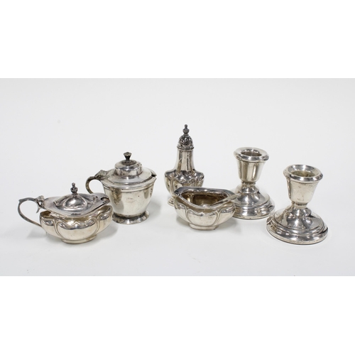 92 - A pair of Birmingham silver desk candlesticks, a Birmingham silver three piece condiment set and a s... 