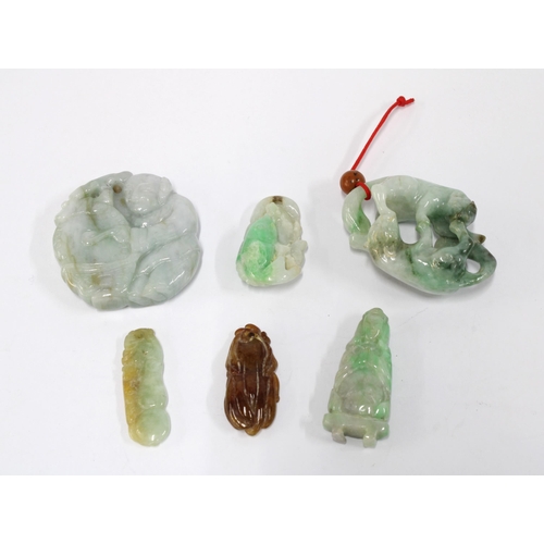 446 - A group of six carved jade pendants to include horses, fish and a seated man, 5.5cm (6)