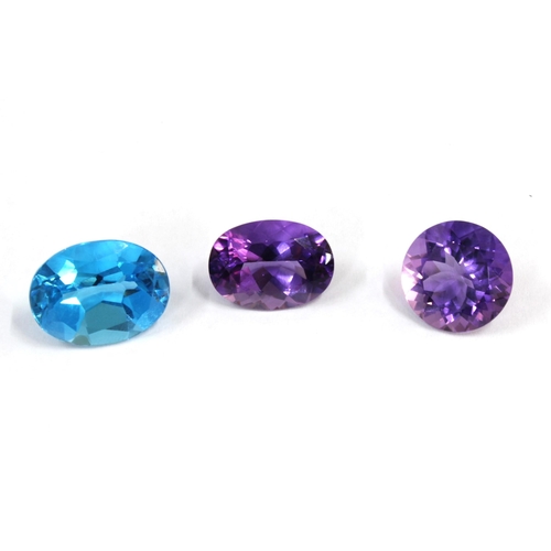 25 - Two unmounted amethysts, facet cut to include an oval, 19mm x 14mm and a circular stone 16mm diamete... 