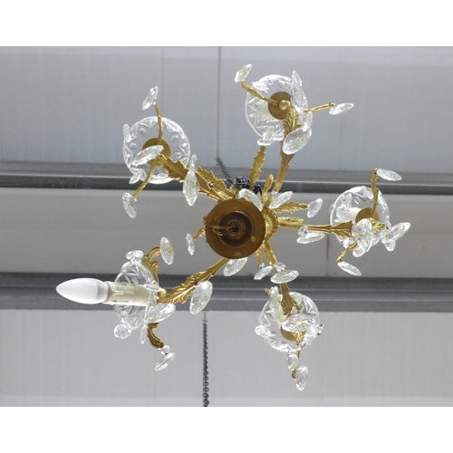 493 - A gilt brass chandelier light fitting with glass lustres, approx 55cm drop