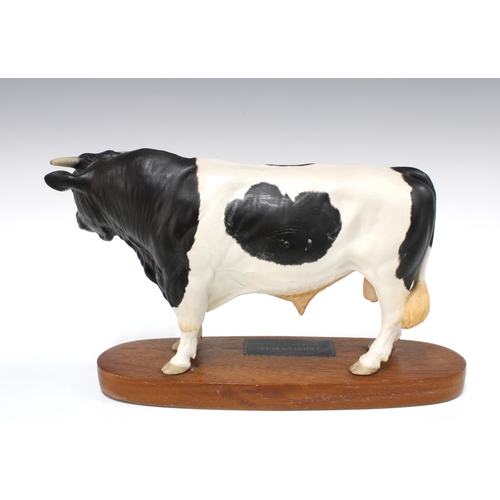 106 - Beswick Connoisseur model of a Friesian bull on wooden base, 19cm