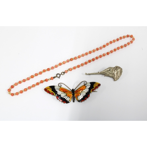 11 - Vintage coral beads, butterfly brooch and elephant head brooch together with an Eastern milk jug and... 