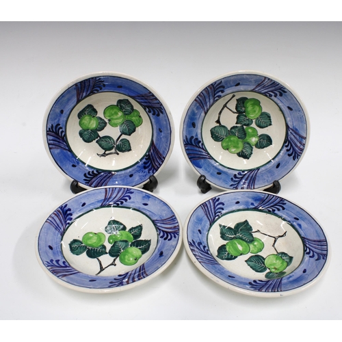 113 - Four early 20th century Scottish pottery handpainted bowls, one with staple repair, signed D.W. LEAF... 