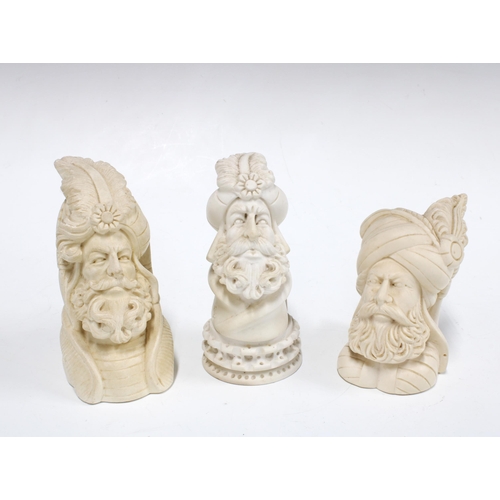 114 - Three Meerschaum type Oriental busts,  with beards and turbans, tallest 12cm (3)