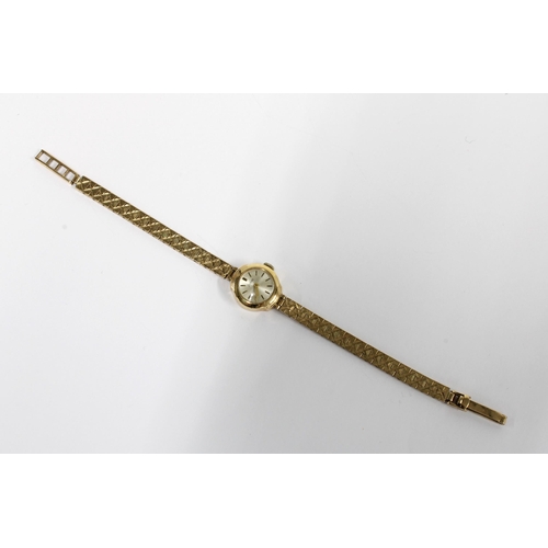 14 - A ladies vintage 9ct gold Zodiac wristwatch on a 9ct gold bracelet strap, stamped 375