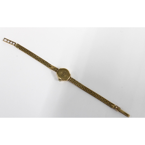 14 - A ladies vintage 9ct gold Zodiac wristwatch on a 9ct gold bracelet strap, stamped 375