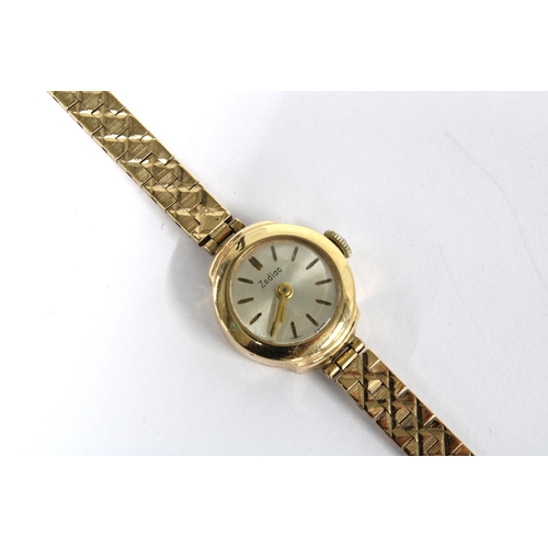 14 - A ladies vintage 9ct gold Zodiac wristwatch on a 9ct gold bracelet strap, stamped 375