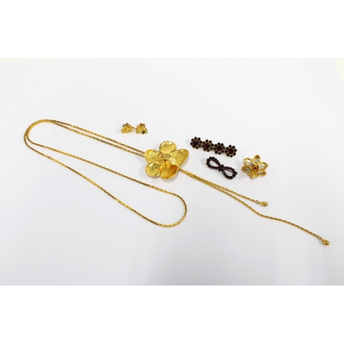 20 - Gold plated orchid necklace, brooch and earrings set and two garnet brooches (5)