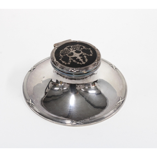 22 - Silver and tortoiseshell mounted capstan inkwell, Birmingham 1912, the circular base with reeded and... 