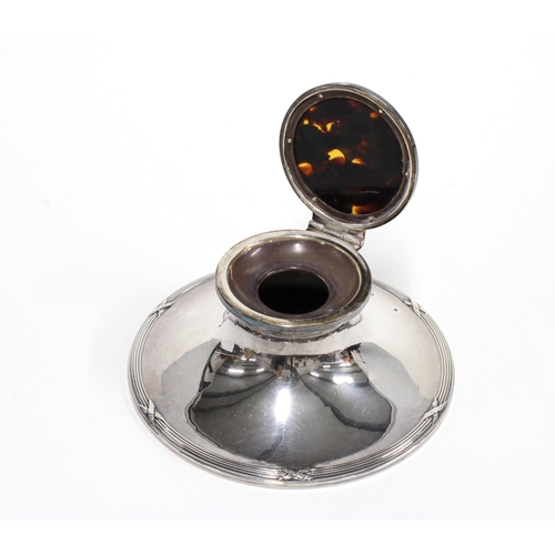 22 - Silver and tortoiseshell mounted capstan inkwell, Birmingham 1912, the circular base with reeded and... 