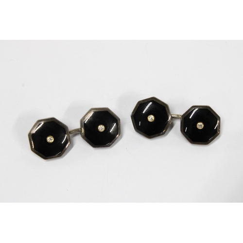 27 - A pair of Gents silver and black onyx diamond set cufflinks (2)