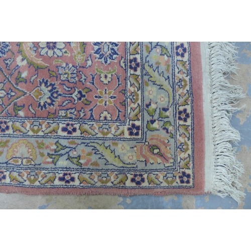 305 - Eastern wool runner with pink field and foliate pattern, 256 x 80cm