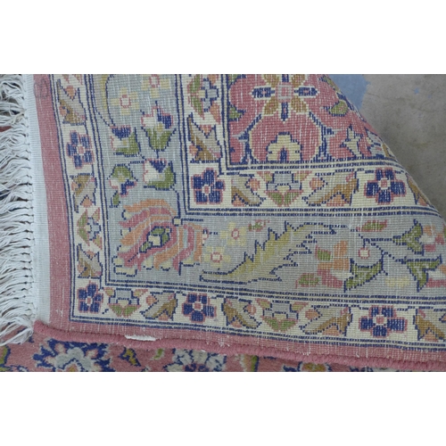 305 - Eastern wool runner with pink field and foliate pattern, 256 x 80cm