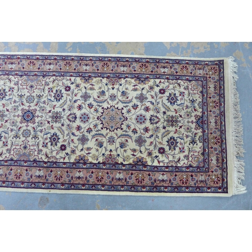 306 - Eastern wool runner with ivory field and allover foliate pattern, 330 x 78cm