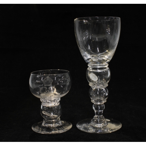 332 - Two coin glass goblets,  one  commemorating the King's Coronation 1937, together with two knop stemm... 