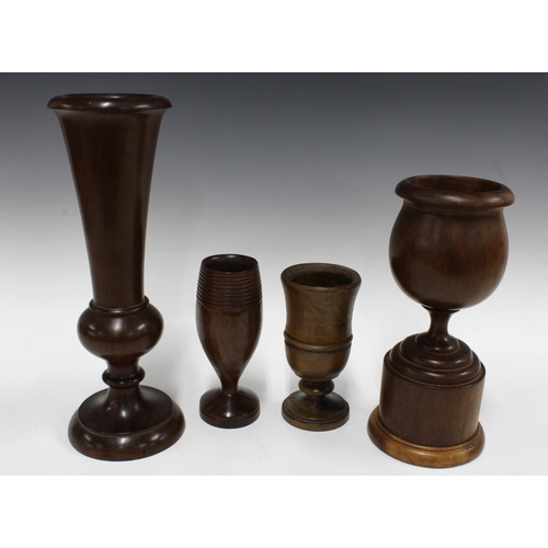 337 - An oversized treen vase and oversized treen goblet together with two smaller, tallest 38cm