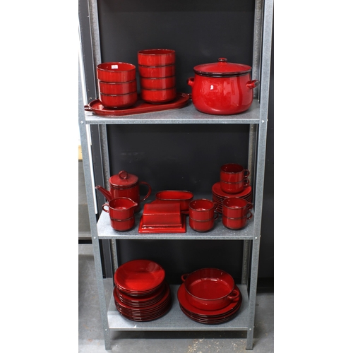 354 - Villeroy & Boch Cordoba pattern red glazed dinner set, over three shelves, approximately 52 pieces