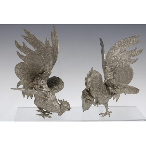 362 - Two silver plated fighting cockerels, 21cm (2)