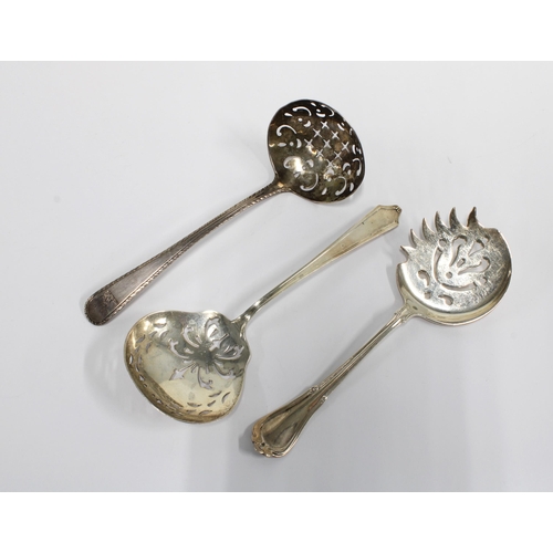 39 - Sterling silver sugar spoon with pierced bowl, stamped International Sterling together with a white ... 