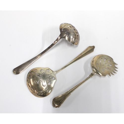 39 - Sterling silver sugar spoon with pierced bowl, stamped International Sterling together with a white ... 