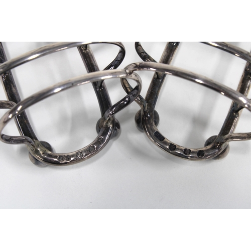 40 - A pair of Victorian silver toastracks, Hamilton & Inches, Edinburgh 1898, 8.5cm (2)