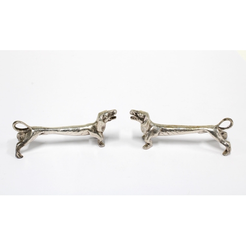 41 - A pair of Edwardian novelty Dachshund silver knife rests, by William Aiken, Birmingham 1904 / 05, 8c... 