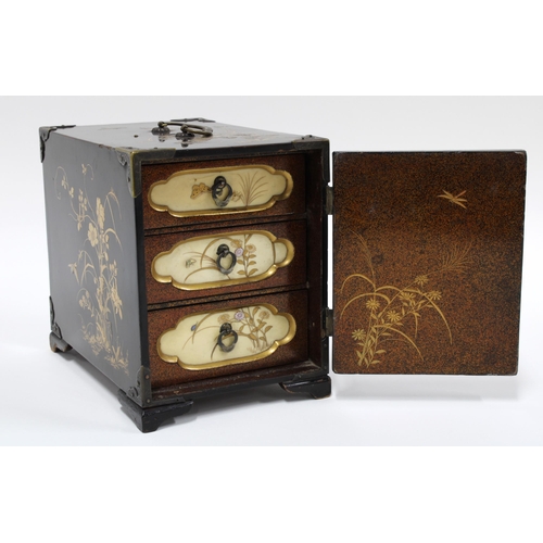 423 - Japanese Shibayama cabinet, black lacquered with gilt decoration, the door with Shibayama ivory pane... 