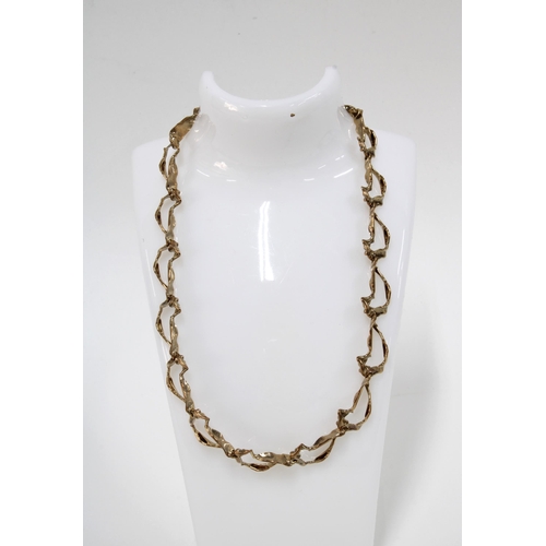 76 - 9ct gold necklace with abstract links, stamped 9ct