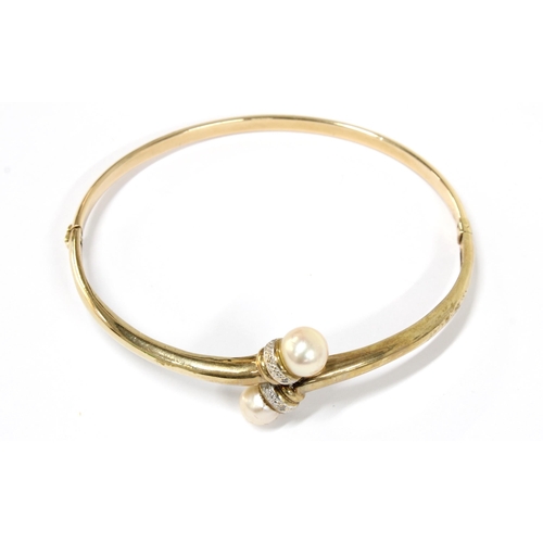 79 - Yellow metal bangle with pearls, indistinct marks to clasp