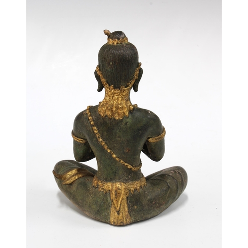 104 - Gilt bronze Buddha, modelled seated with a flute, 15cm