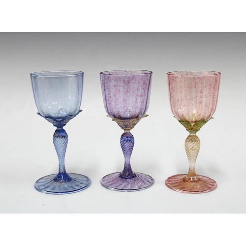 133 - Three Venetian coloured wine glasses, with petal stems, 16cm (3)