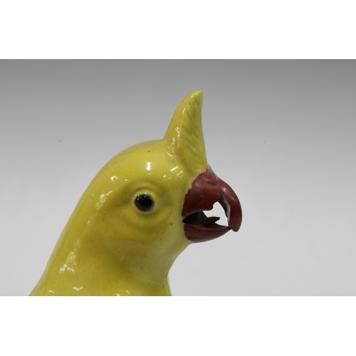 140 - Pair of 20th century Chinese yellow glazed birds , (one a/f) 20cm (2)