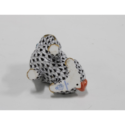 142 - Herend handpainted fishnet porcelain seated pug, printed factory marks and model number 15729, 7cm