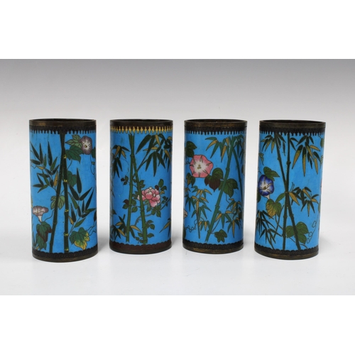 151 - Set of four cloisonne brush pots, with bamboo, flowers and butterflies on a blue field, 12cm (4)