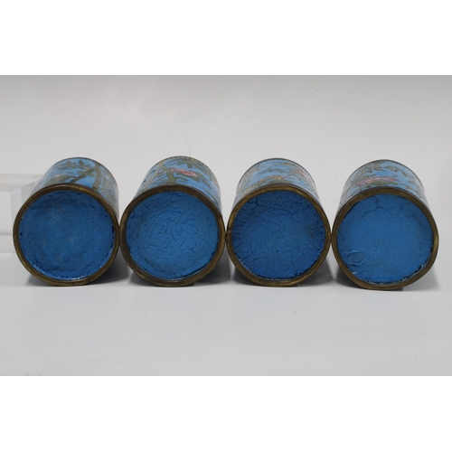 151 - Set of four cloisonne brush pots, with bamboo, flowers and butterflies on a blue field, 12cm (4)