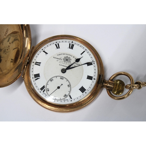 18 - A 9ct gold Hunter pocket watch by Thos. Russell, the signed enamel dial with roman numerals and rail... 