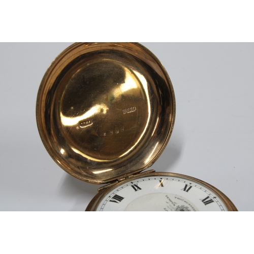 18 - A 9ct gold Hunter pocket watch by Thos. Russell, the signed enamel dial with roman numerals and rail... 