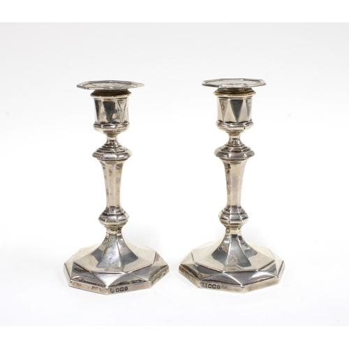 26 - A pair of George V silver knop stem candlesticks with octagonal sconce and footrims, (weighted) , Ha... 